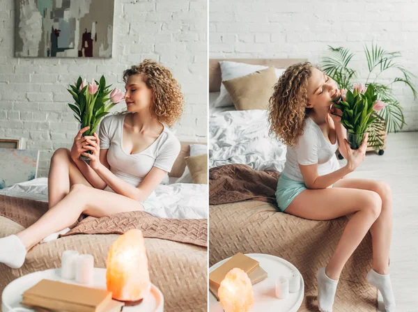 Красивая счастливая девушка с тюльпановыми цветами в спальне с гималайской соляной лампой и книгами — стоковое фото