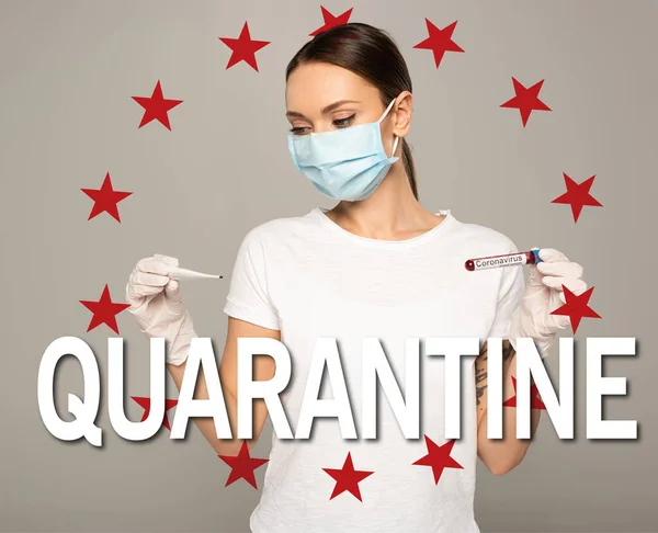 Woman in medical mask holding thermometer and test tube with blood sample and coronavirus lettering isolated on grey, quarantine and stars illustration — Stock Photo