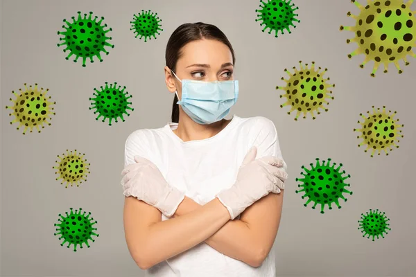 Young woman in medical mask and latex gloves looking away isolated on grey, bacteria illustration — Stock Photo