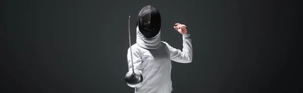 Panoramic orientation of fencer training isolated on black — Stock Photo