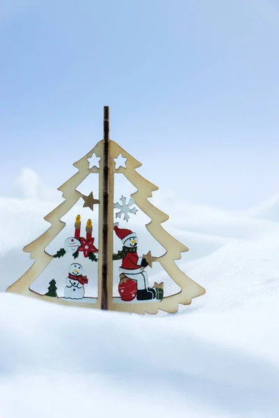 Macro photo of wood snowman on the Christmas tree with light and — Stock Photo, Image