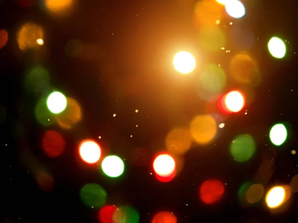 Lichte bokeh met een zwarte achtergrond. — Stockfoto