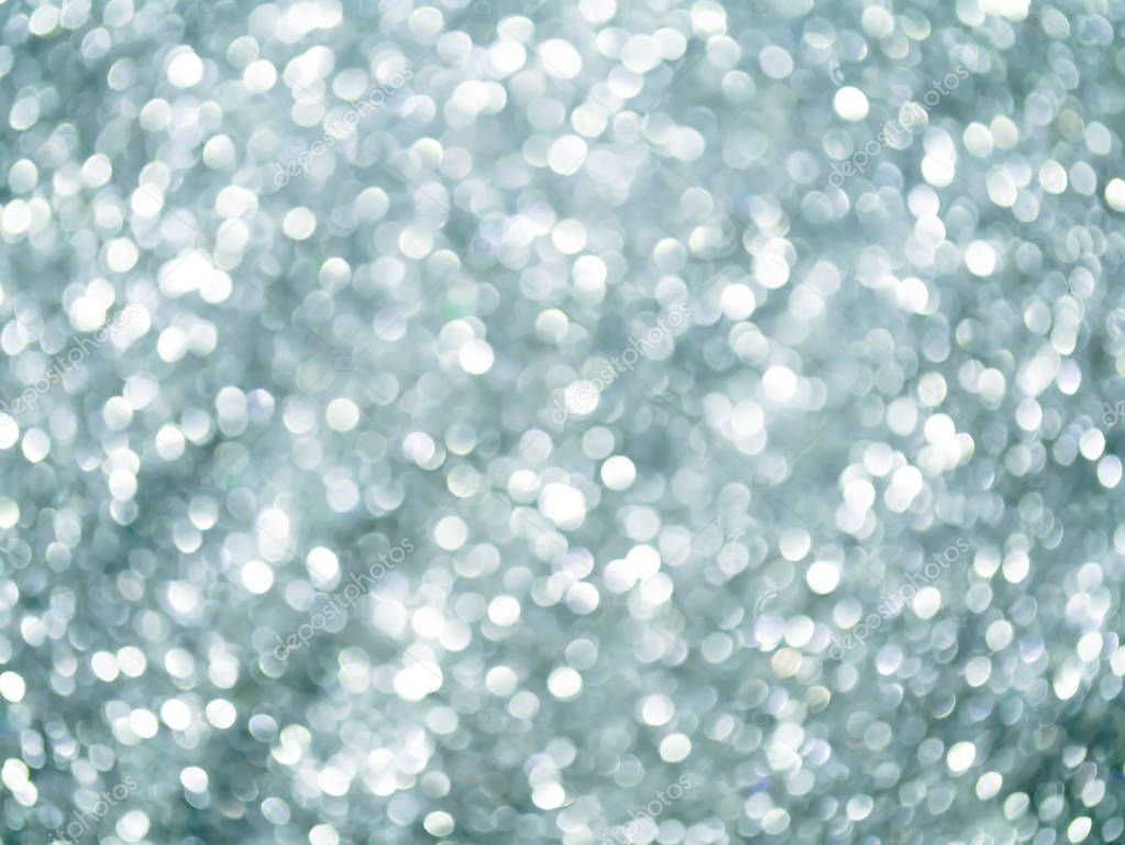 Silver Sparkling Glitter bokeh Background.