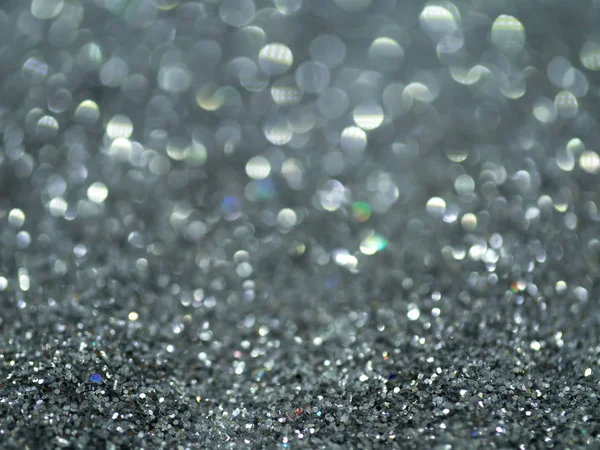 Stříbrný přívěsek Glitter bokeh pozadí. — Stock fotografie