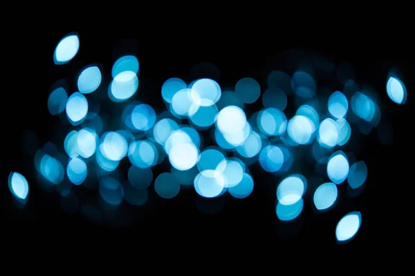 Helles Bokeh mit schwarzem Hintergrund. — Stockfoto