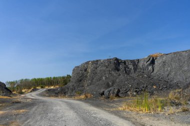 The road into the Granite mountains with blue sky background.