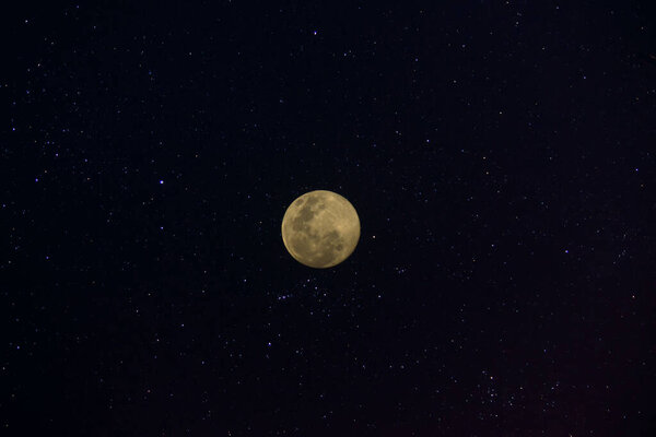 full moon in the dark background with soft star.