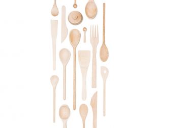 Top view of various wooden kitchen utensils isolated on white clipart