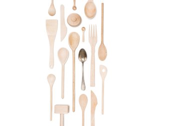 Top view of various wooden cooking utensils and silver spoon isolated on white clipart