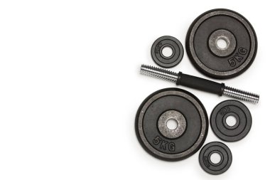 Top view of heavy weight plates with iron bar isolated on white clipart
