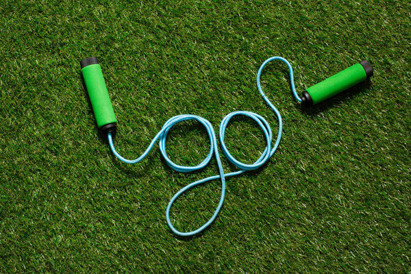 top view of skipping rope on the grass in form of word go