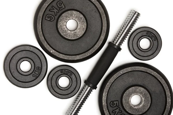 Top view of heavy weight plates with iron bar isolated on white — Stock Photo, Image