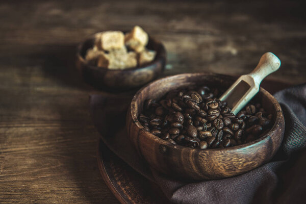 coffee beans and brown sugar on tabletop