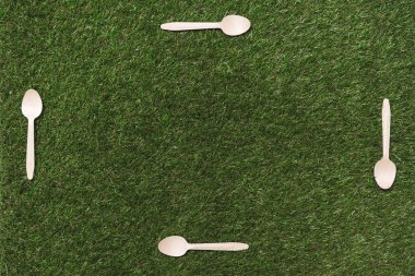 wooden spoons on grass clipart