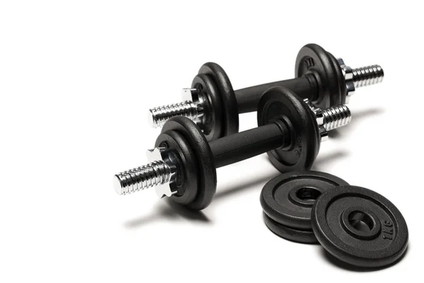 Iron dumbbells with weight plates — Stock Photo, Image