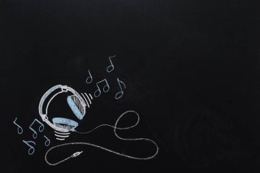 headphones with musical notes drawn on chalkboard clipart
