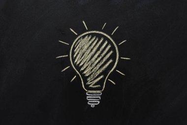 electric bulb drawn on black chalkboard clipart
