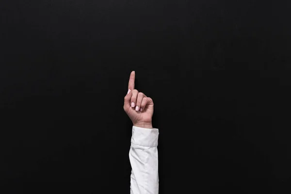 Businesswoman pointing up with finger — Stock Photo, Image