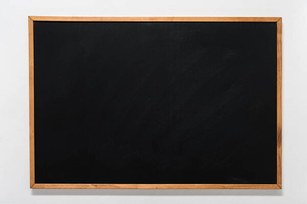 empty school blackboard in wooden frame