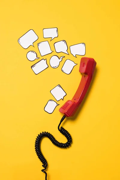 Telephone handset and speech bubbles — Stock Photo, Image