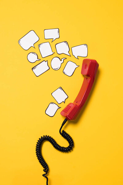 Telephone handset and speech bubbles