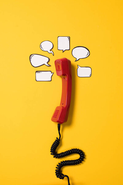 Telephone handset and speech bubbles