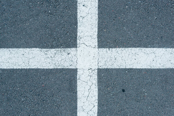 white parking lines on roadway