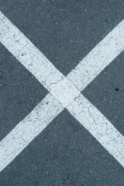 white parking lines on roadway