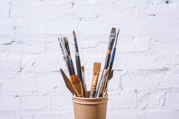 Paint Brushes Paper Cups White Wall — Stock Photo, Image