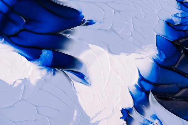 close-up view of abstract blue, grey and white painting background 