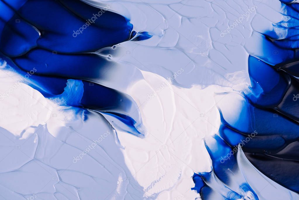 close-up view of abstract blue, grey and white painting background 