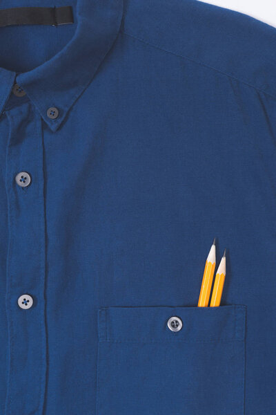 close-up view of stylish blue shirt with pencils in pocket   