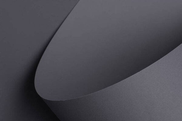 abstract dark grey background made of paper