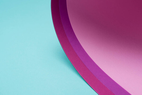 twisted pink and purple paper on turquoise 