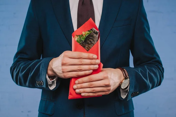 Cropped Shot Businessman Suit Holding Doner Covered Red Paper — Stock Photo, Image