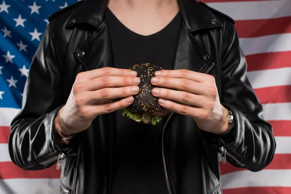 Cropped Shot Man Leather Jacket Holding Black Burger Usa Flag — Stock Photo, Image