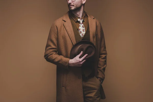 Stylish Man Wearing Coat Holding Hat Isolated Brown — Stock Photo, Image