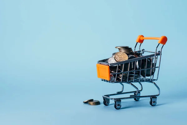Close View Little Shopping Trolley Full Coins Isolated Blue — Stock Photo, Image