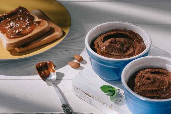 Toast Bread Chocolate Bowls Cocoa Powder White Wooden Table — Stock Photo, Image