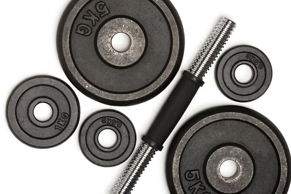 Top view of heavy weight plates with iron bar isolated on white — Stock Photo