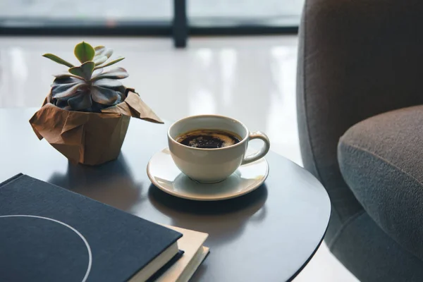 Cup of coffee and books — Stock Photo