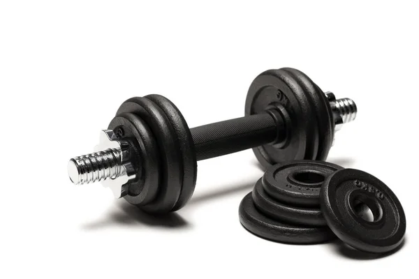 Iron dumbbell with weight plates — Stock Photo