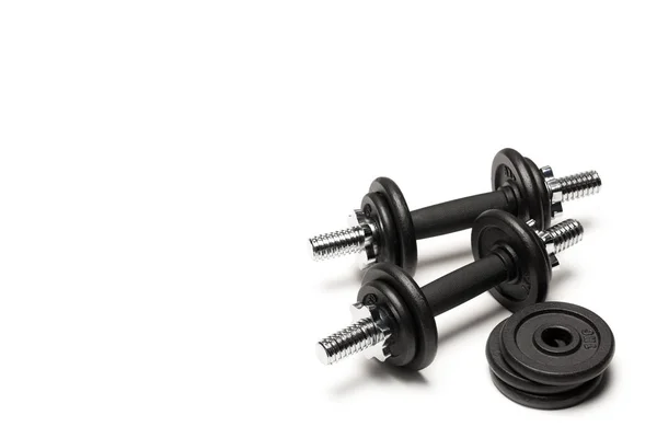 Iron dumbbells with weight plates — Stock Photo