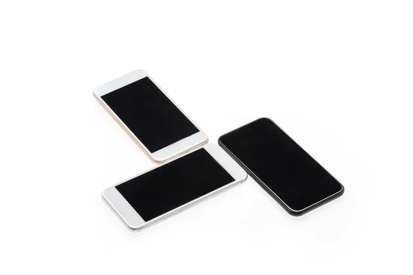 Modern smartphones with black screens — Stock Photo