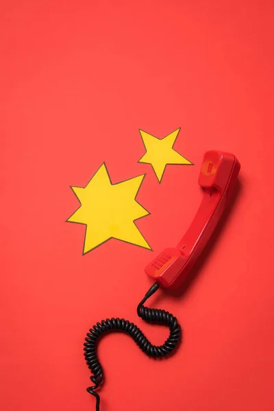 Telephone handset and speech bubbles — Stock Photo