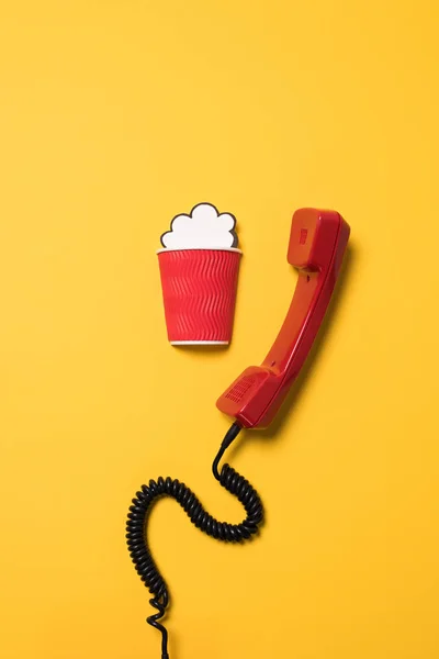 Telephone handset and paper cup — Stock Photo