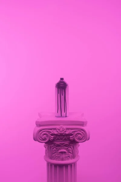 Pink toned picture of aerosol paint in can on column — Stock Photo