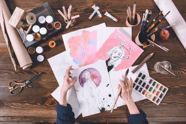 Top view of artist painting with watercolor paints — Stock Photo