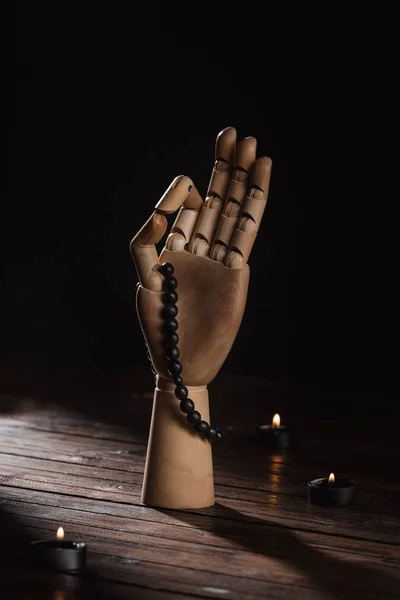 Wooden hand with gyan mudra gesture and rosary — Stock Photo