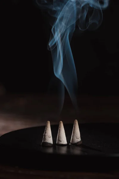Three burning incense sticks with smoke — Stock Photo